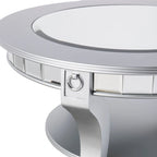 Mesa de centro redonda con espejo en plata mate, tablero de cristal y estante inferior